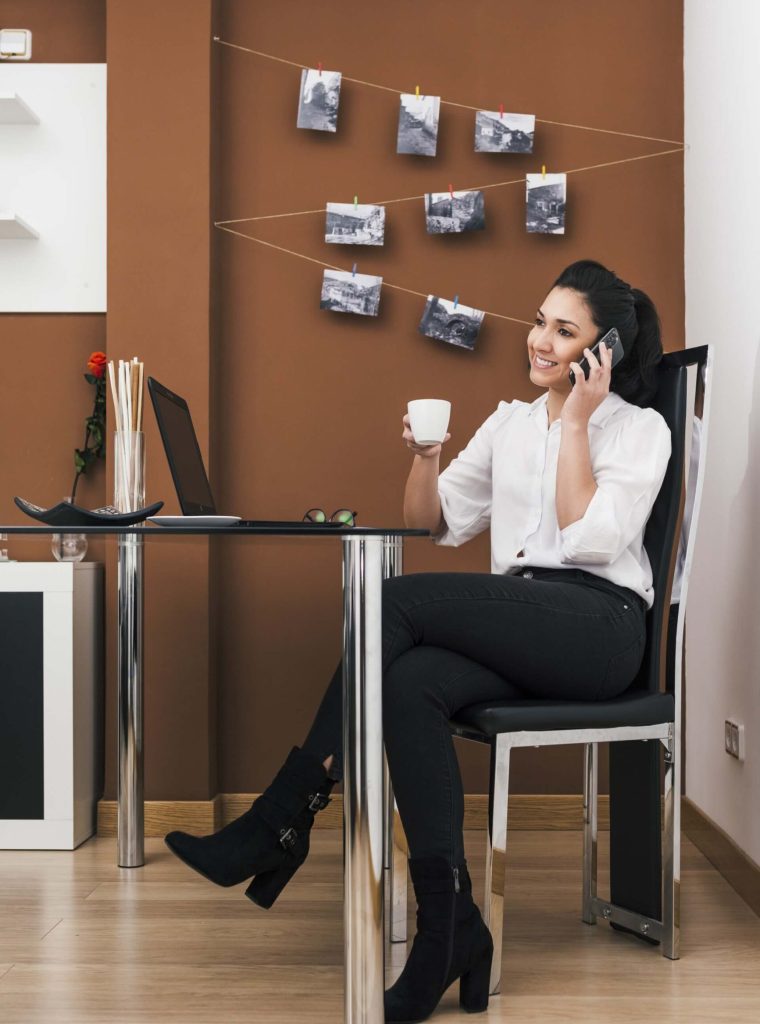 attractive-young-businesswoman-drinking-coffee-working-office (1) (1)